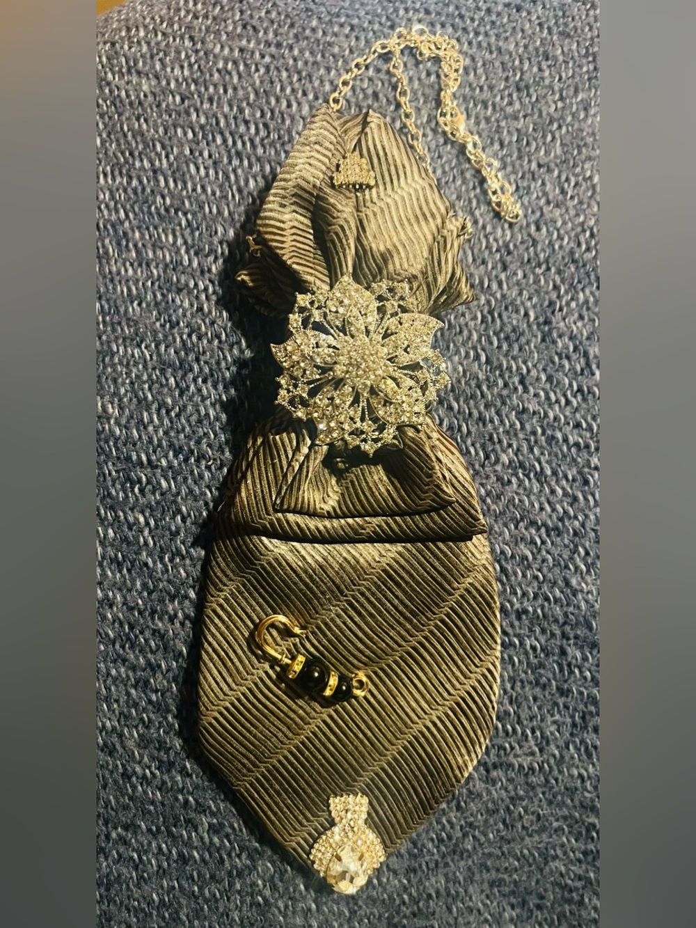 Elegant Gold Tie with Silver Brooch
